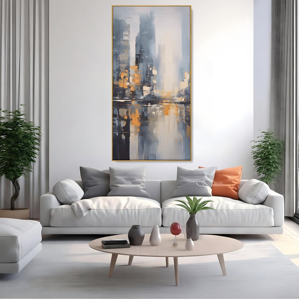 Tablou canvas cu pictura abstracta cu cladiri si reflexii, in rama de aluminiu auriu, pe perete intr-un living